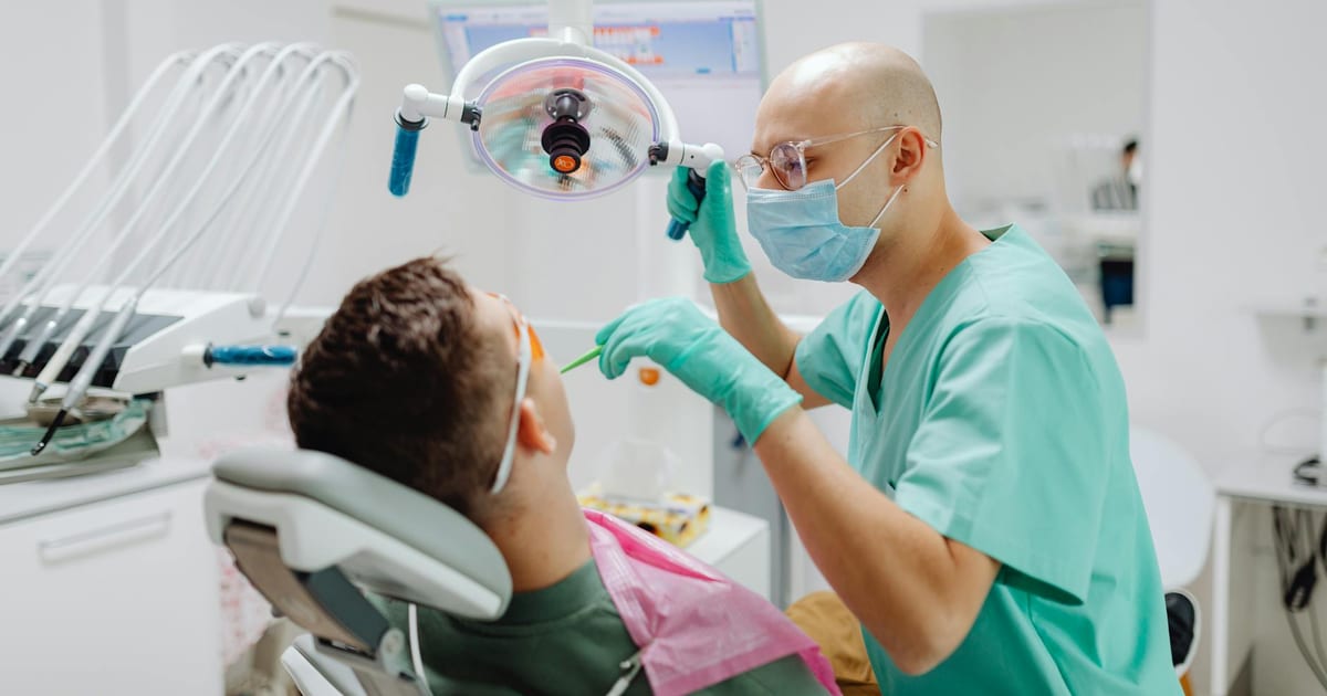Adult having a dental examination, representing dental check-up frequency guidelines for adults