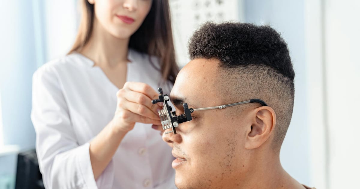 Adult having an eye exam, representing routine eye examination frequency guidelines for adults