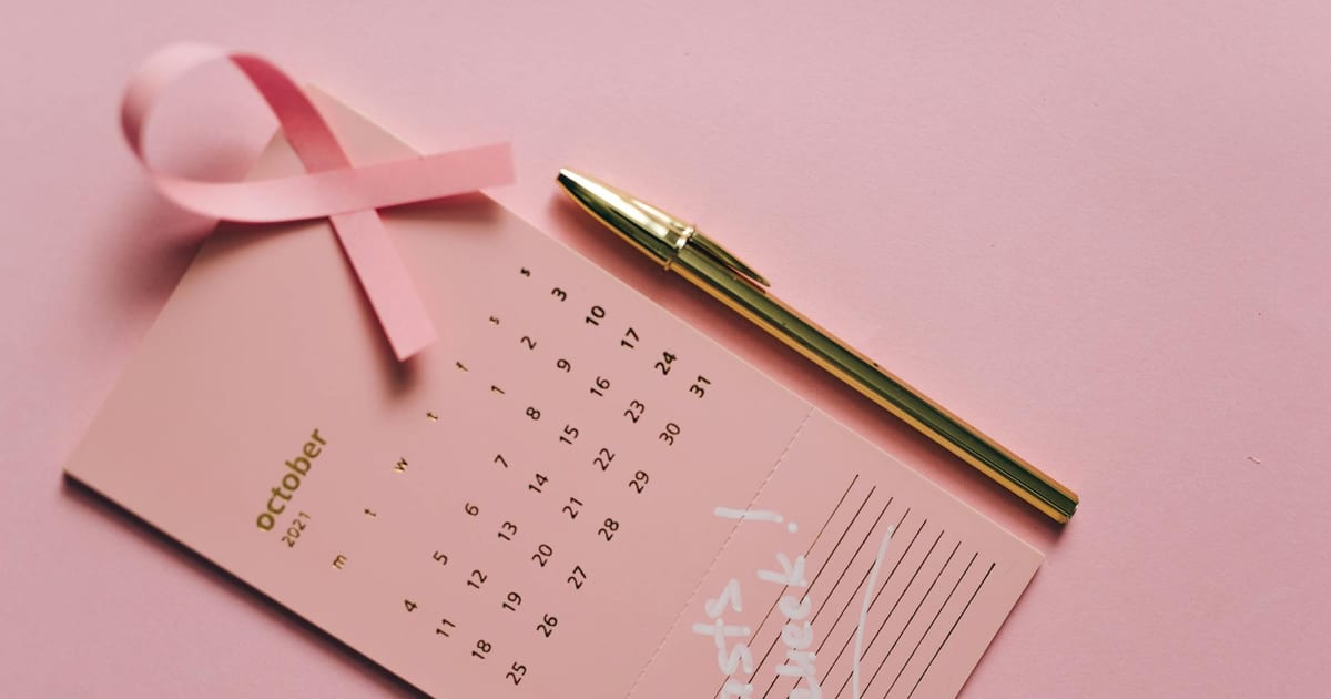 Woman reviewing a health screening schedule, representing mammogram frequency guidance by age