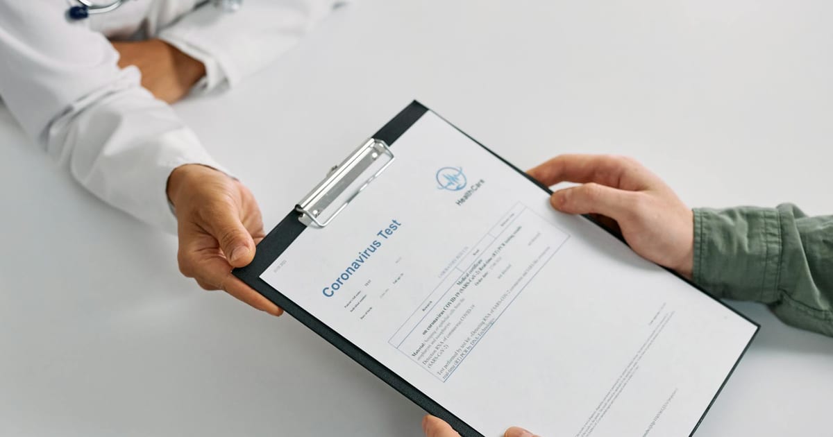 Person looking at a health checklist, representing the balance between screening and over-screening